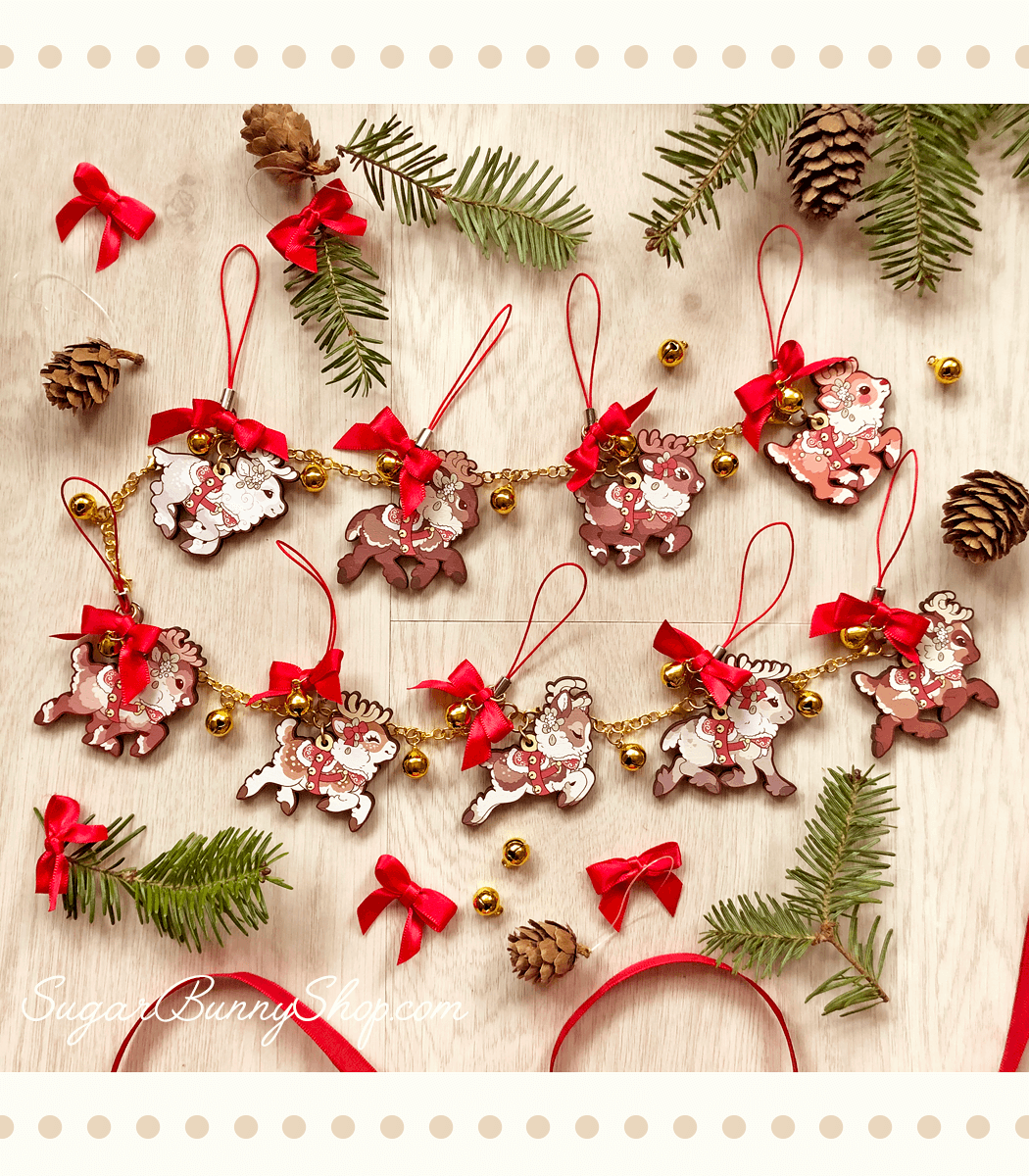 A photo of a garland of wooden ornaments featuring nine unique designs for Santa&