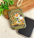 Sundew Farms faux sunflower seed packet fridge magnet with a fox design on a wooden surface.