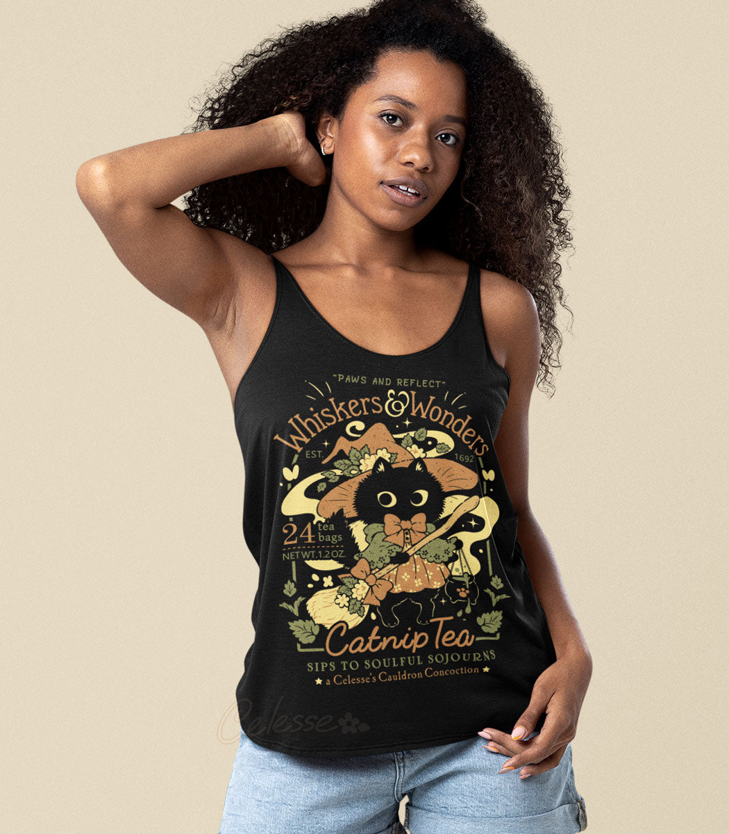 Whiskers & Wonders Catnip Tea Tank Top. A woman wearing a black tank top with a cat-themed design on a beige background.
