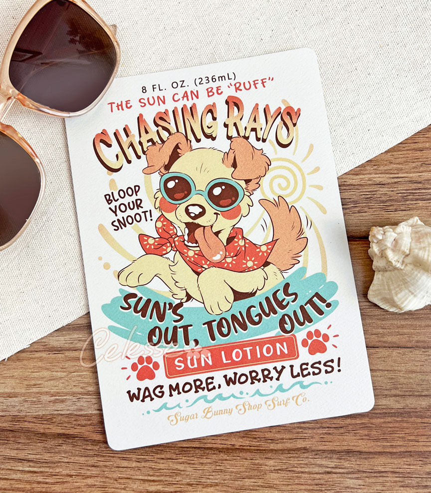 An art print of a vintage-style logo for Chasing Rays Sun Lotion, the art featuring an energetic, floppy-eared dog wearing a bandana and sunglasses. The flavor text reads, "Sun&