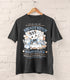 A photo of a dark gray shirt on a wood hanger, the print featuring a faux logo for Kneady Kitten Baker&