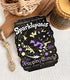 A vinyl sticker with a print of a retro faux candy logo for Sparklepaws Popping Candy, the art featuring a black cat with star paw pads leaping among bursting sparkles. The flavor text reads, "Dazzlingly delicious!" and "Frolic among the stardust!"