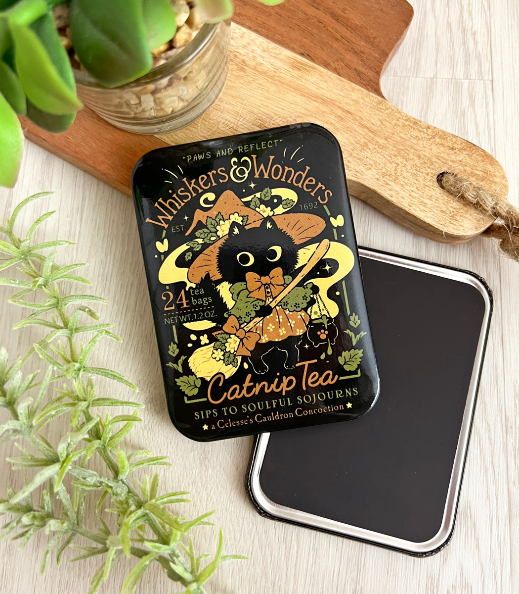 Catnip Tea faux logo magnet with a Halloween witch cat design on a wooden surface with plants.